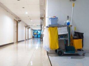 Cart with Cleaning Tools in Hallway for Janitorial Service in Doral, FL
